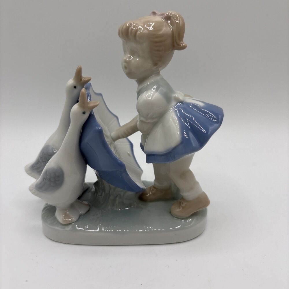 Vintage Young Girl with Umbrella Holding Back Ducks Geese Porcelain Figurine